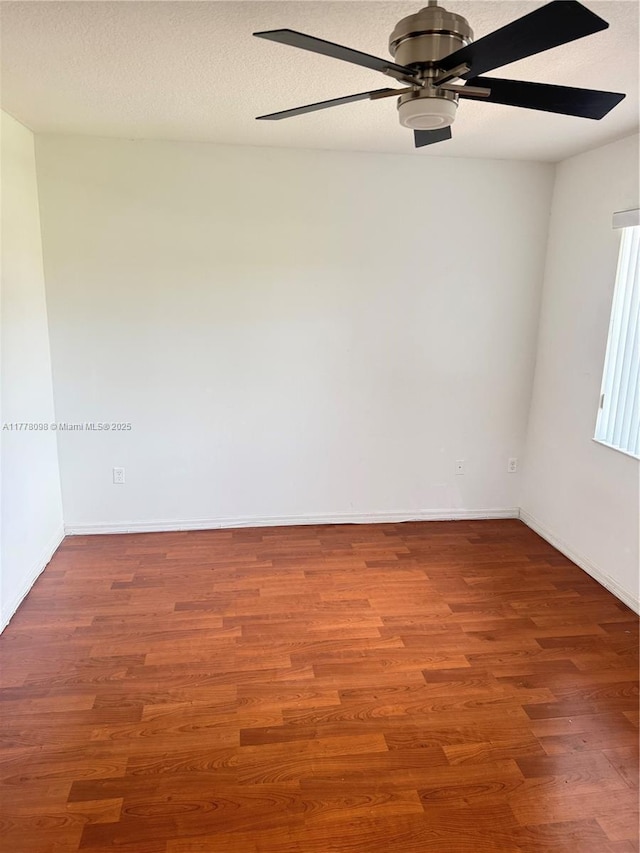 5031 SW 135th Ave Unit 5031, Miramar, FL 33027 - empty room with ceiling fan, wood finished floors, and baseboards