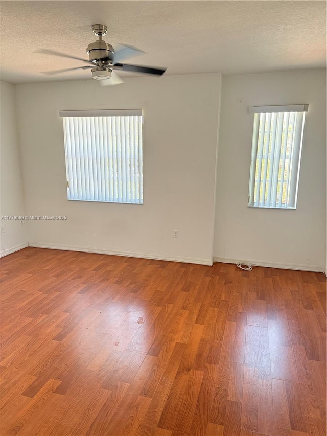 5031 SW 135th Ave Unit 5031, Miramar, FL 33027 - empty room featuring ceiling fan, wood finished floors, and baseboards