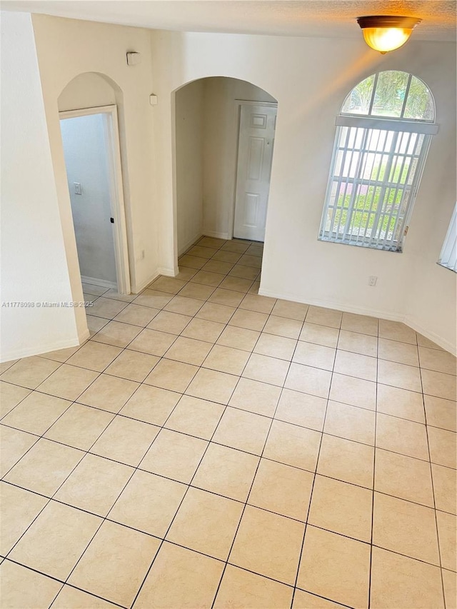 5031 SW 135th Ave Unit 5031, Miramar, FL 33027 - unfurnished room featuring arched walkways and light tile patterned floors