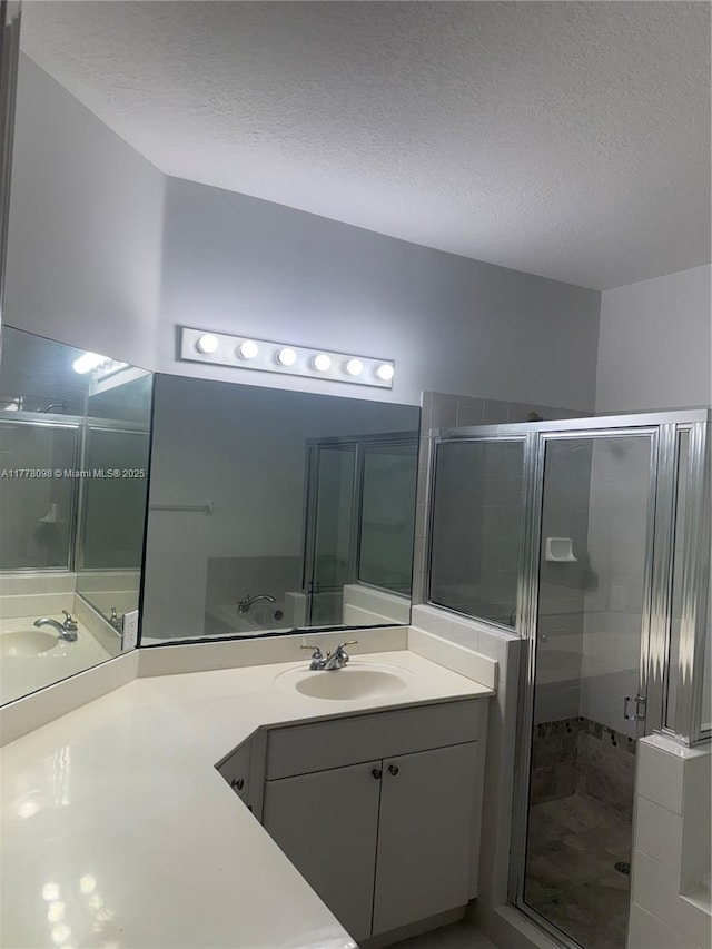 5031 SW 135th Ave Unit 5031, Miramar, FL 33027 - full bathroom with a shower stall, a textured ceiling, and vanity
