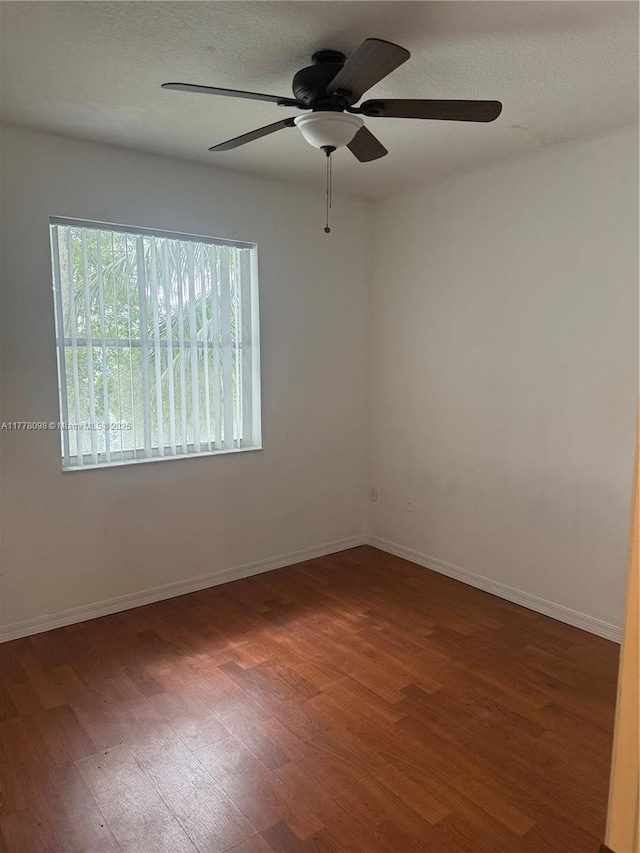 5031 SW 135th Ave Unit 5031, Miramar, FL 33027 - unfurnished room with wood finished floors, a ceiling fan, and baseboards