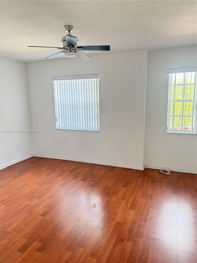 5031 SW 135th Ave Unit 5031, Miramar, FL 33027 - empty room featuring wood finished floors, ceiling fan, and baseboards