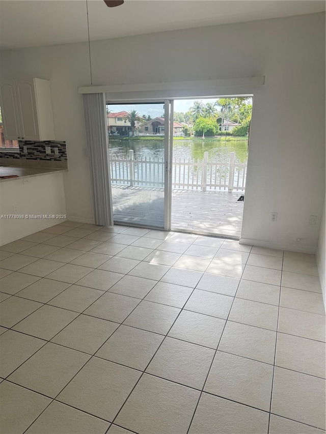 5031 SW 135th Ave Unit 5031, Miramar, FL 33027 - spare room with a water view and light tile patterned flooring