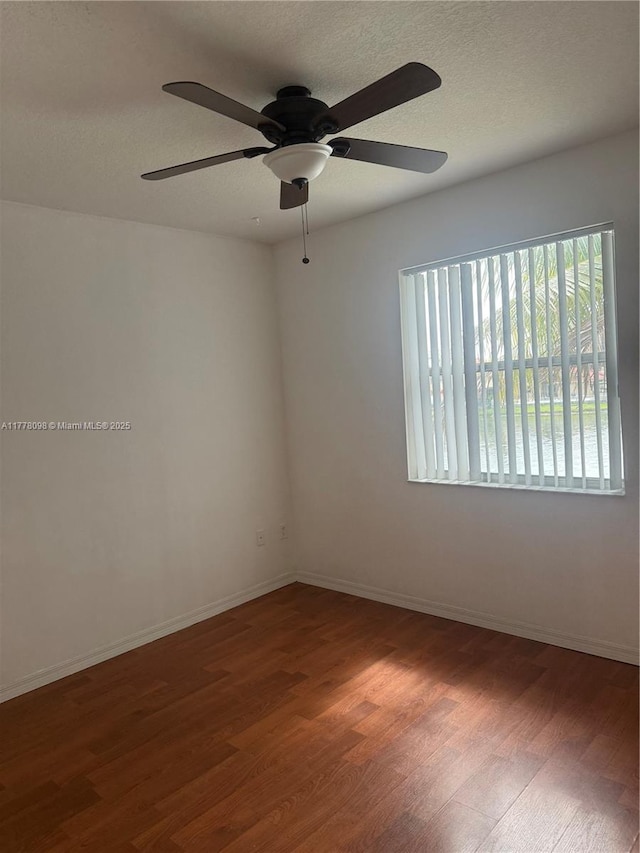 5031 SW 135th Ave Unit 5031, Miramar, FL 33027 - unfurnished room with wood finished floors, ceiling fan, baseboards, and a textured ceiling