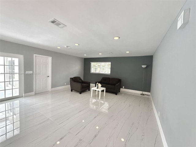 sitting room with marble finish floor, recessed lighting, baseboards, and visible vents