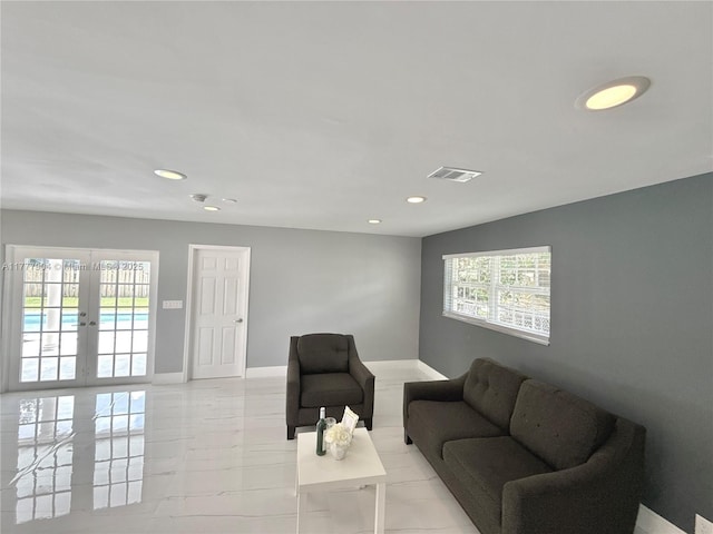 living room with french doors, marble finish floor, baseboards, visible vents, and recessed lighting