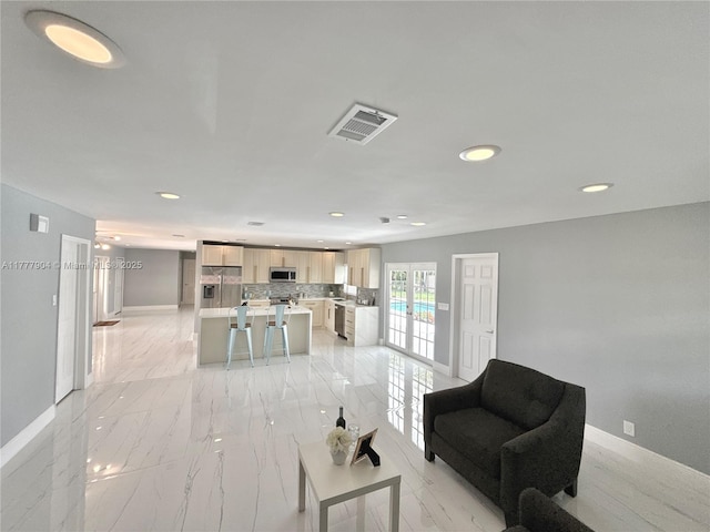 living room featuring marble finish floor, recessed lighting, baseboards, and visible vents