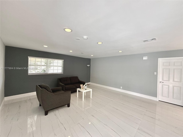 living area featuring baseboards, marble finish floor, visible vents, and recessed lighting