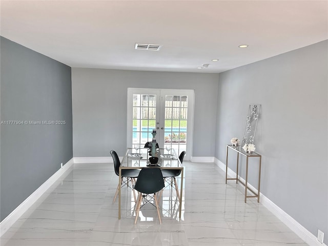 dining space featuring visible vents, baseboards, marble finish floor, recessed lighting, and french doors