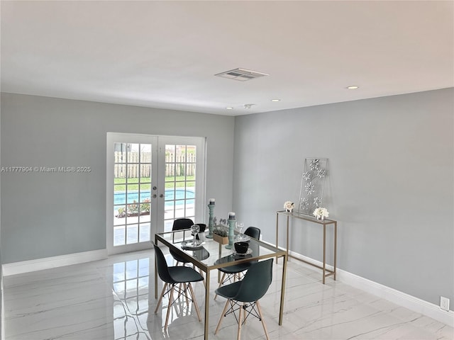 dining room with french doors, marble finish floor, baseboards, and visible vents