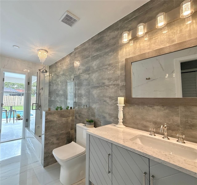 full bathroom with a shower, vanity, tile walls, toilet, and visible vents
