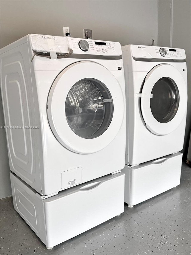 laundry area featuring washing machine and dryer