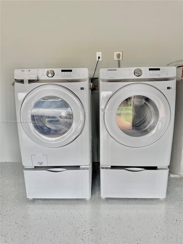 clothes washing area with washer and dryer
