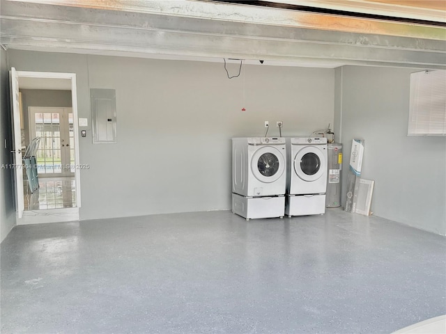 laundry room with water heater, laundry area, electric panel, and washer and dryer