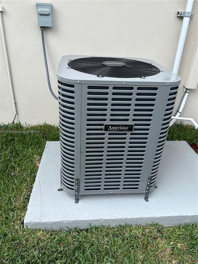 exterior details with stucco siding and central AC unit