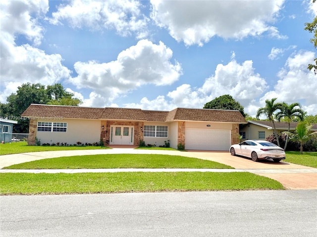 ranch-style home featuring driveway, an attached garage, a front lawn, and stucco siding