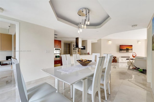 4000 Island Blvd Unit 402, Aventura, FL 33160 - dining area featuring a raised ceiling and light tile patterned flooring