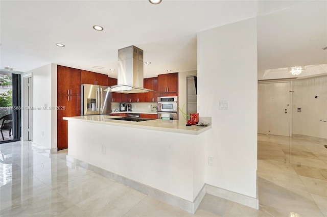 4000 Island Blvd Unit 402, Aventura, FL 33160 - kitchen with modern cabinets, light countertops, a peninsula, stainless steel appliances, and island range hood