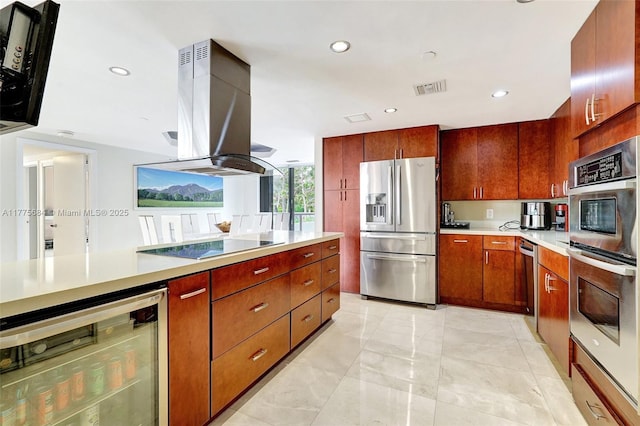 4000 Island Blvd Unit 402, Aventura, FL 33160 - kitchen featuring visible vents, appliances with stainless steel finishes, light countertops, beverage cooler, and extractor fan
