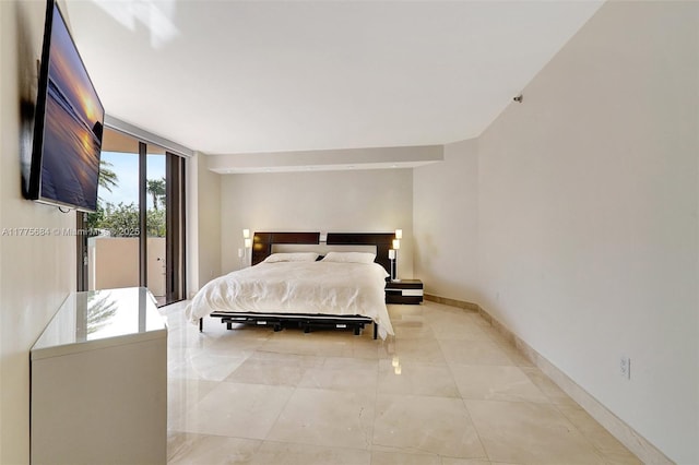 4000 Island Blvd Unit 402, Aventura, FL 33160 - bedroom with expansive windows, access to exterior, and baseboards