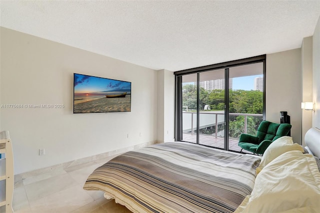 4000 Island Blvd Unit 402, Aventura, FL 33160 - tiled bedroom with a textured ceiling, access to outside, and floor to ceiling windows