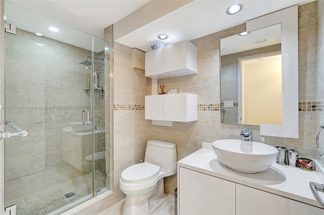 4000 Island Blvd Unit 402, Aventura, FL 33160 - full bathroom with tile walls, toilet, a shower stall, recessed lighting, and vanity
