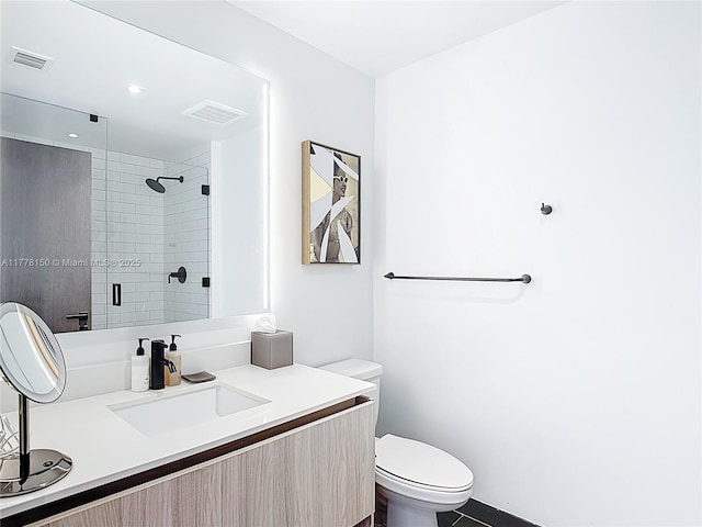 full bath featuring visible vents, a shower stall, toilet, and vanity