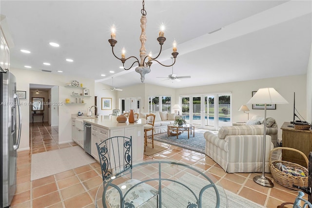 1999 NW 107th Dr, Coral Springs, FL 33071 - interior space with vaulted ceiling, recessed lighting, light tile patterned floors, ceiling fan with notable chandelier, and visible vents