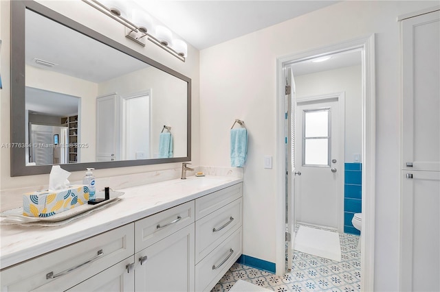 1999 NW 107th Dr, Coral Springs, FL 33071 - bathroom featuring baseboards, visible vents, toilet, and vanity