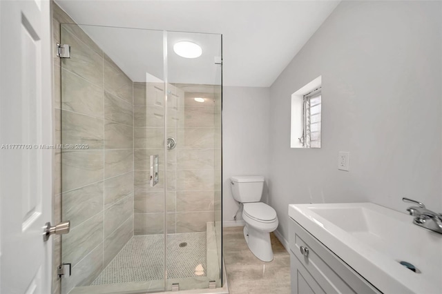 full bathroom with toilet, a stall shower, wood finished floors, and vanity
