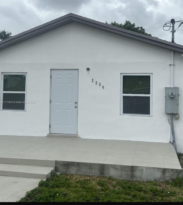 exterior space with stucco siding
