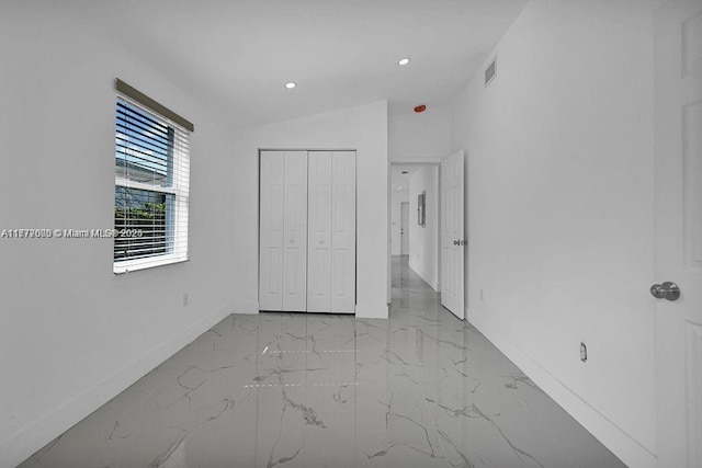 unfurnished bedroom with recessed lighting, a closet, marble finish floor, visible vents, and baseboards