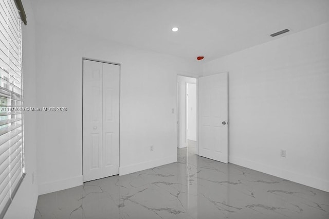 unfurnished bedroom featuring baseboards, recessed lighting, visible vents, and marble finish floor