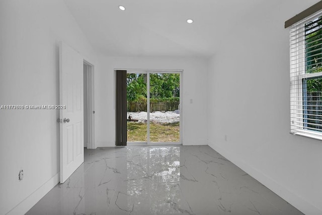 unfurnished room with recessed lighting, marble finish floor, and baseboards