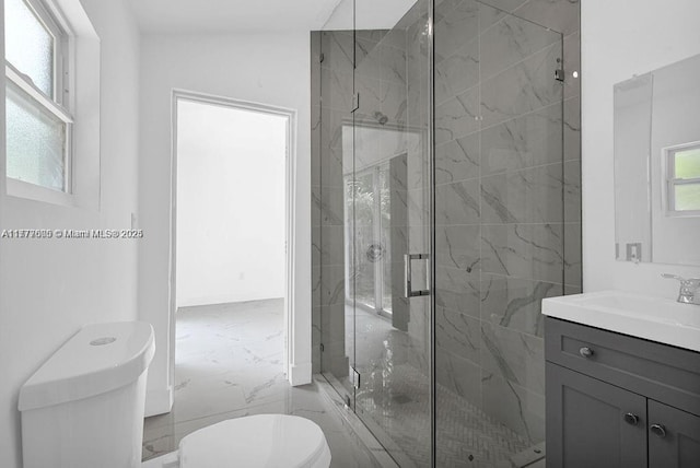 full bath featuring a marble finish shower, toilet, vanity, and marble finish floor