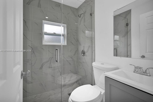 full bathroom with toilet, a marble finish shower, and vanity