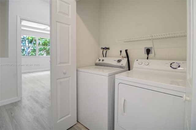 12376 SW 126th Ave Unit 12376, Miami, FL 33186 - laundry room with washer and dryer and light wood-style flooring