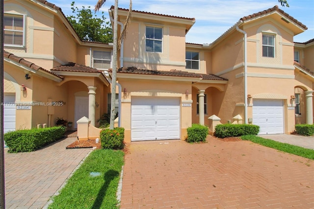 12376 SW 126th Ave Unit 12376, Miami, FL 33186 - view of front facade featuring stucco siding, a garage, decorative driveway, and a tile roof