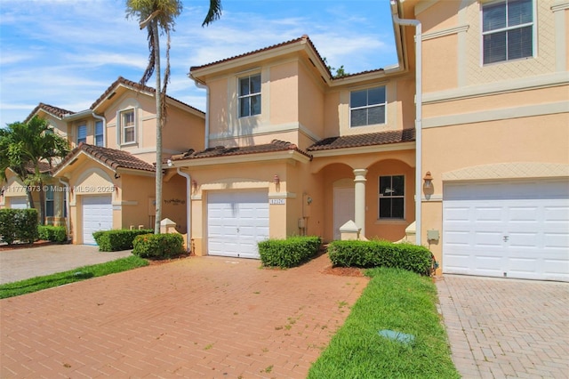 12376 SW 126th Ave Unit 12376, Miami, FL 33186 - multi unit property featuring stucco siding, a tile roof, decorative driveway, and an attached garage