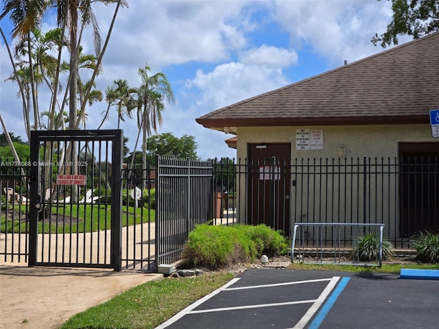 view of gate with fence