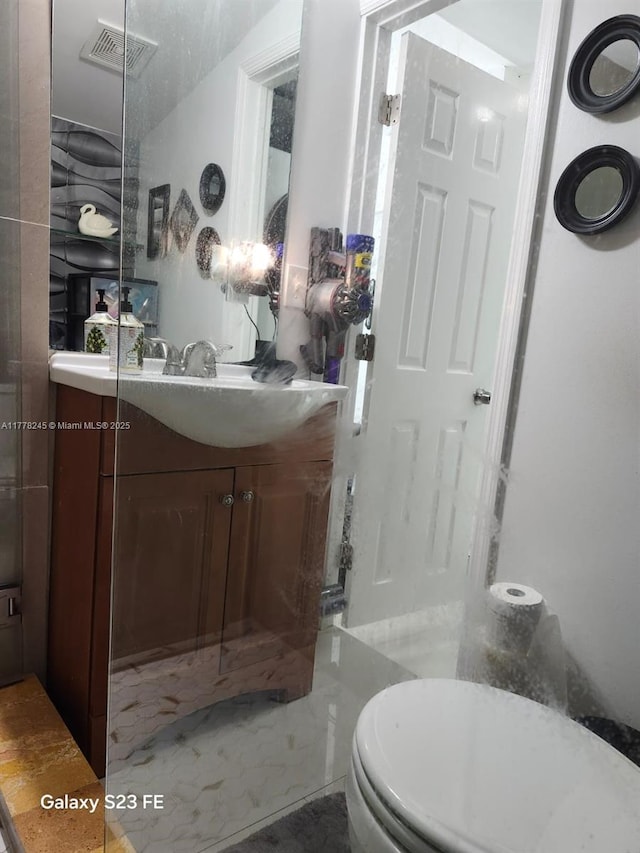 bathroom featuring visible vents and vanity