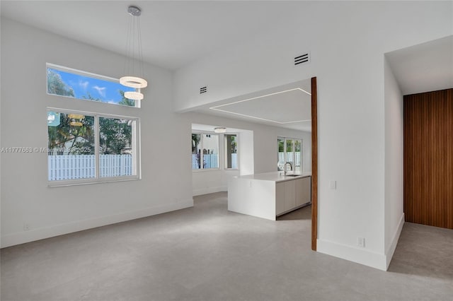 852 Heritage Dr, Weston, FL 33326 - unfurnished living room featuring a sink and baseboards