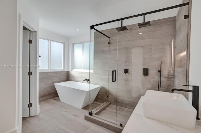 852 Heritage Dr, Weston, FL 33326 - bathroom with a stall shower, a freestanding tub, tile walls, and a sink