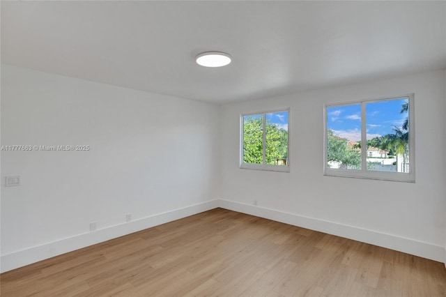 852 Heritage Dr, Weston, FL 33326 - empty room with light wood-style flooring and baseboards