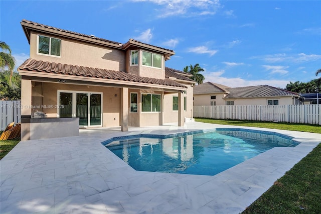 852 Heritage Dr, Weston, FL 33326 - rear view of property featuring a patio area, stucco siding, and a tiled roof