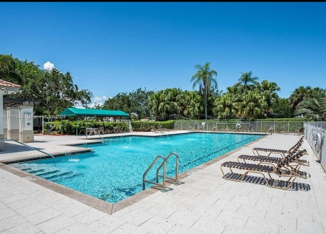 852 Heritage Dr, Weston, FL 33326 - community pool featuring a patio area