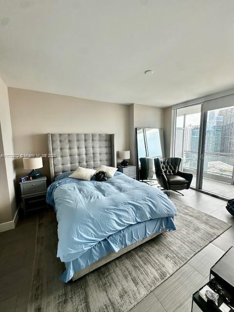 92 SW 3rd St Unit 4104, Miami, FL 33130 - bedroom featuring access to exterior and wood finished floors