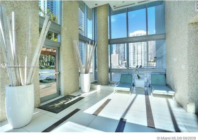 92 SW 3rd St Unit 4104, Miami, FL 33130 - building lobby with a towering ceiling and a city view