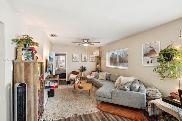 4580 NW 3rd Ave, Oakland Park, FL 33309 - living room with visible vents, ceiling fan, heating unit, and wood finished floors