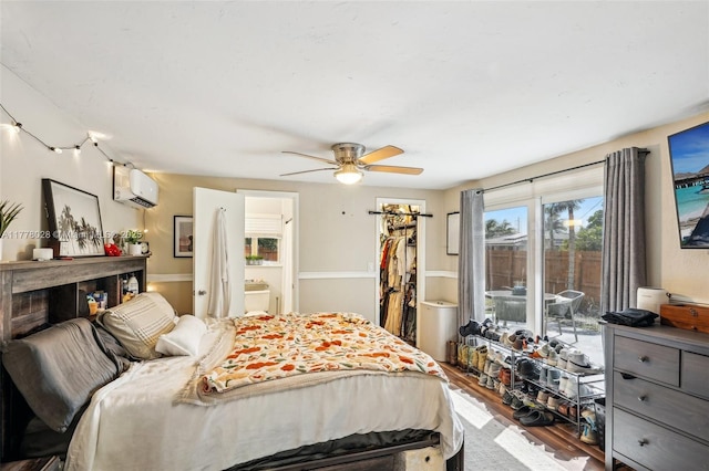 4580 NW 3rd Ave, Oakland Park, FL 33309 - bedroom with ensuite bathroom, a wall mounted air conditioner, a spacious closet, wood finished floors, and access to outside